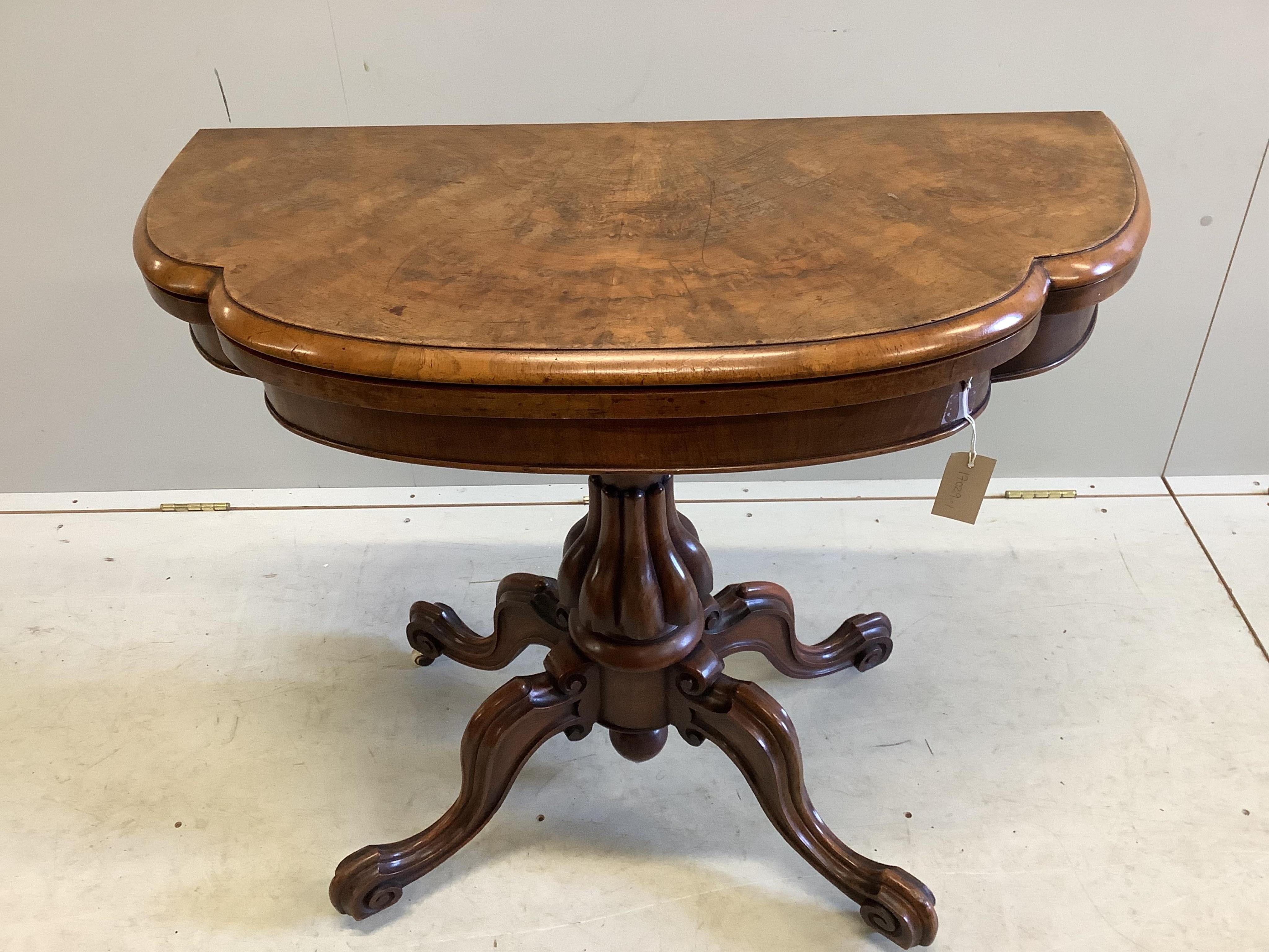 A Victoria figured walnut folding card table, width 91cm, depth 45cm, height 76cm. Condition - fair